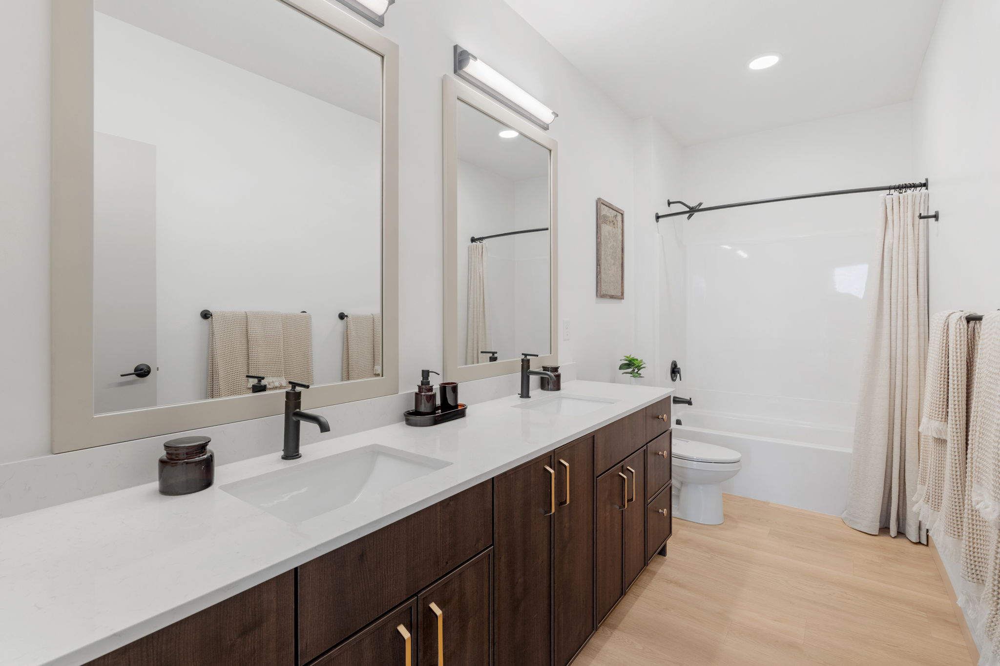 Bathroom with double vanity and bath