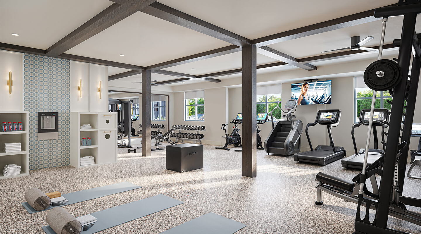 Modern apartment fitness center with treadmills, weights, and yoga mats