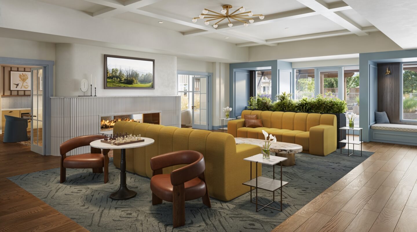 Stylish apartment clubhouse with mustard yellow sofas and modern decor