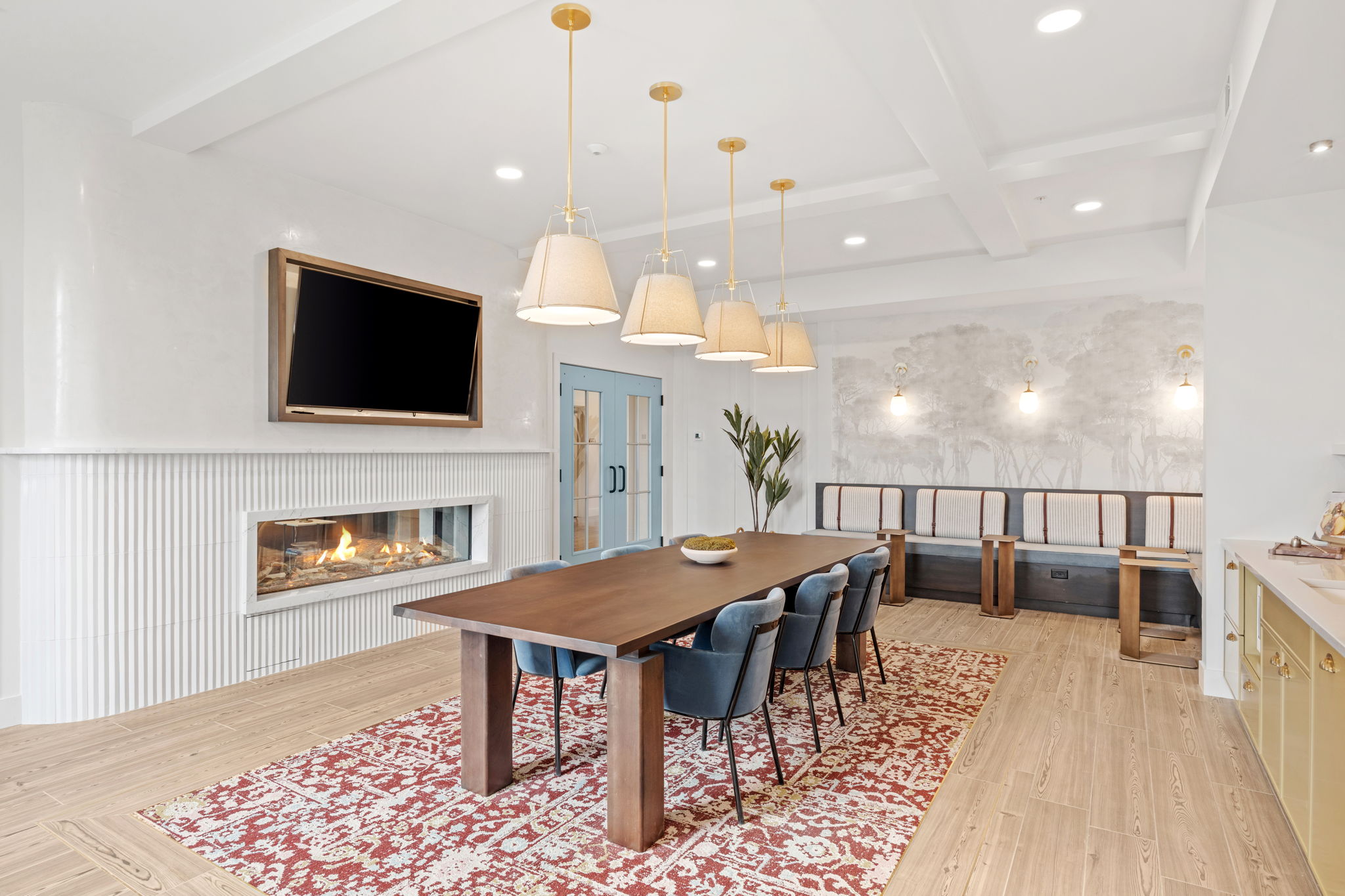 Community room with fireplace and tv near main seating area