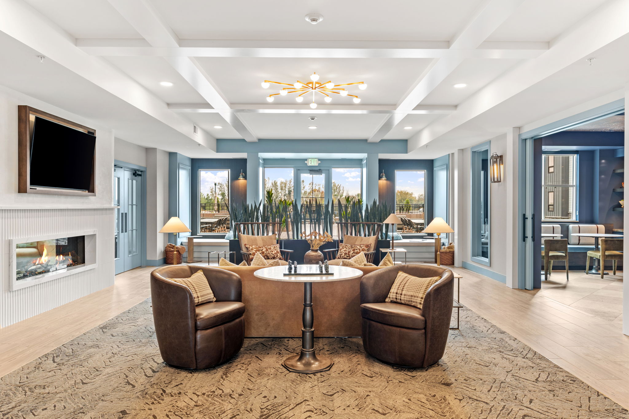 Lobby with open seating and chess set leading out to pool deck